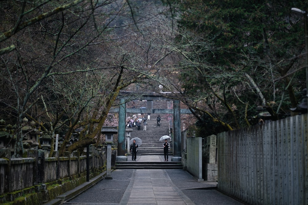 a group of people walking up a set of stairs