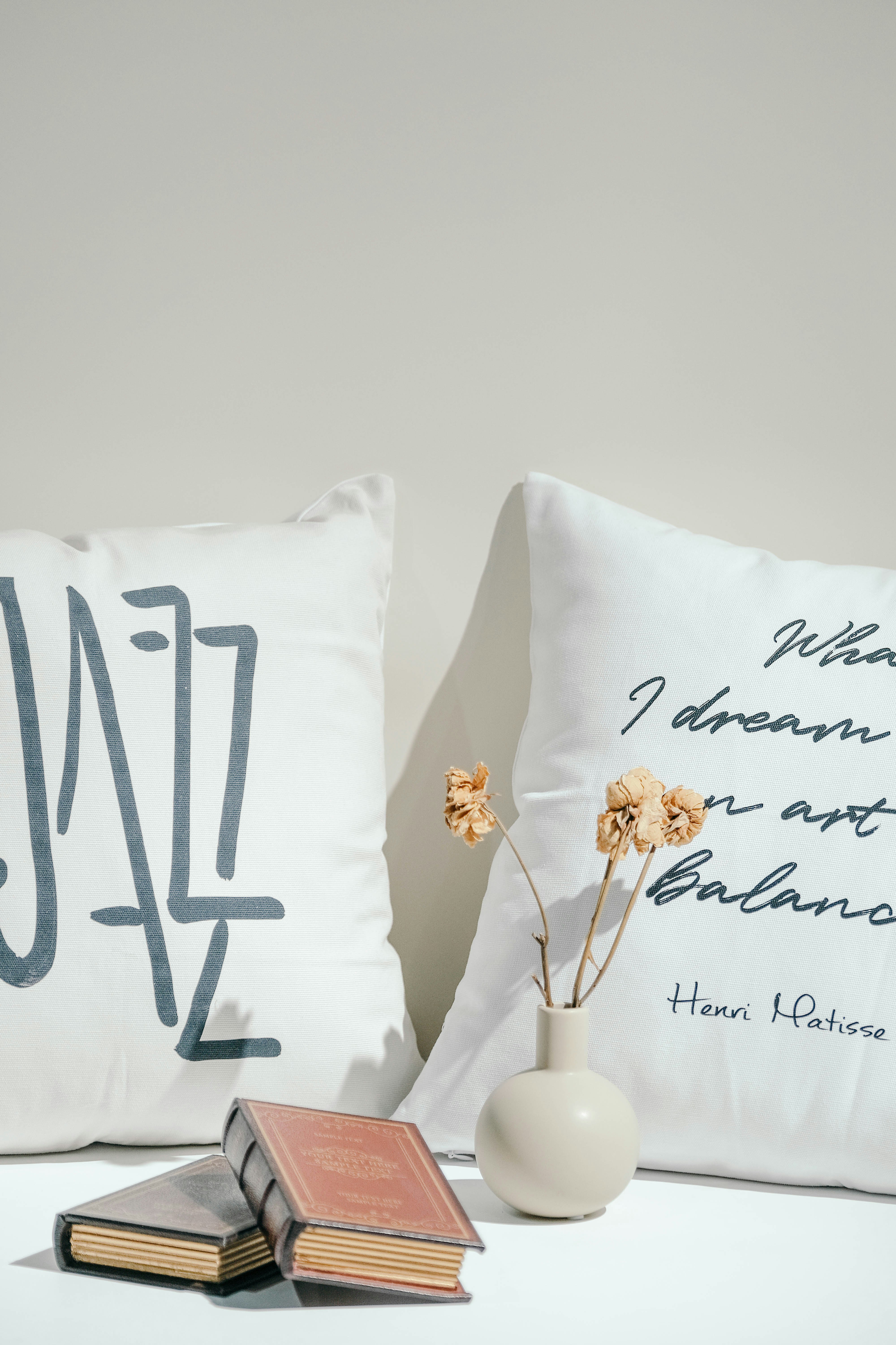 a couple of pillows sitting on top of a bed