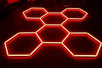 a bunch of hexagons that are lit up in the dark