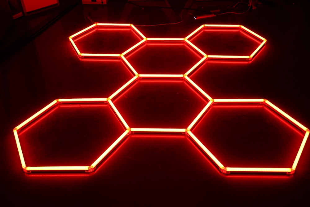 a bunch of hexagons that are lit up in the dark