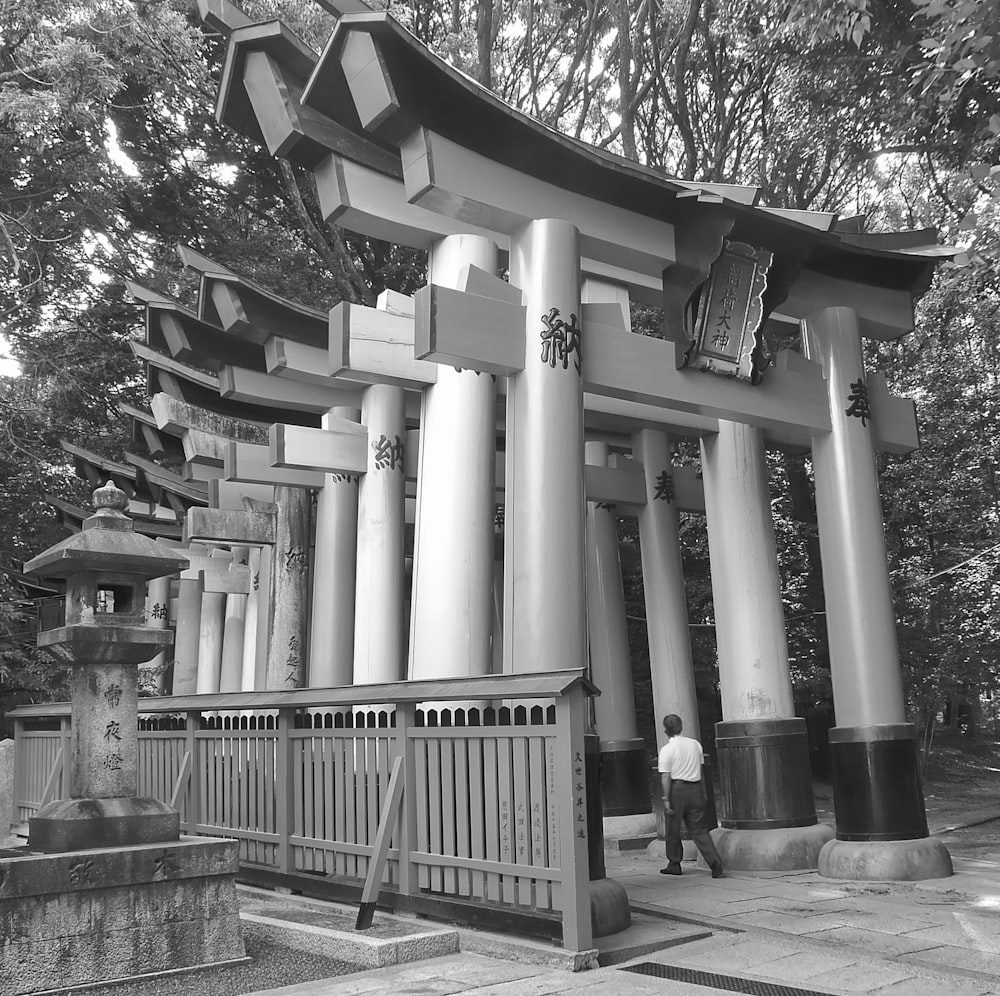 a man standing in front of a tall structure