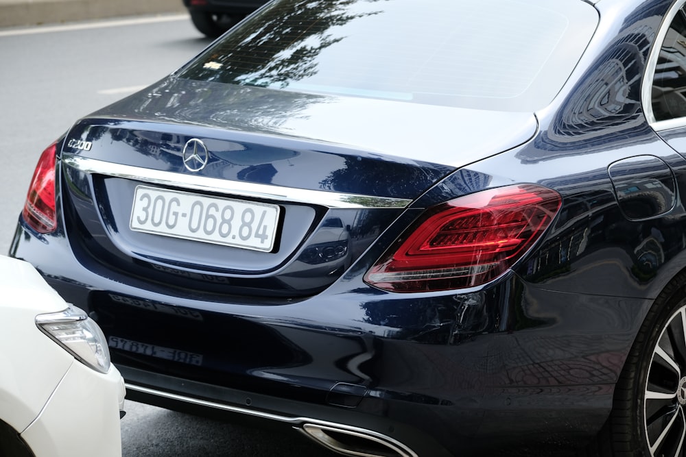 a close up of a car parked on the side of the road