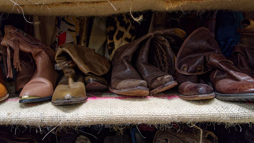 a bunch of shoes that are on a shelf