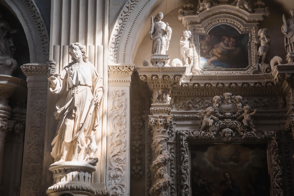 a statue of a man holding a baby in a church