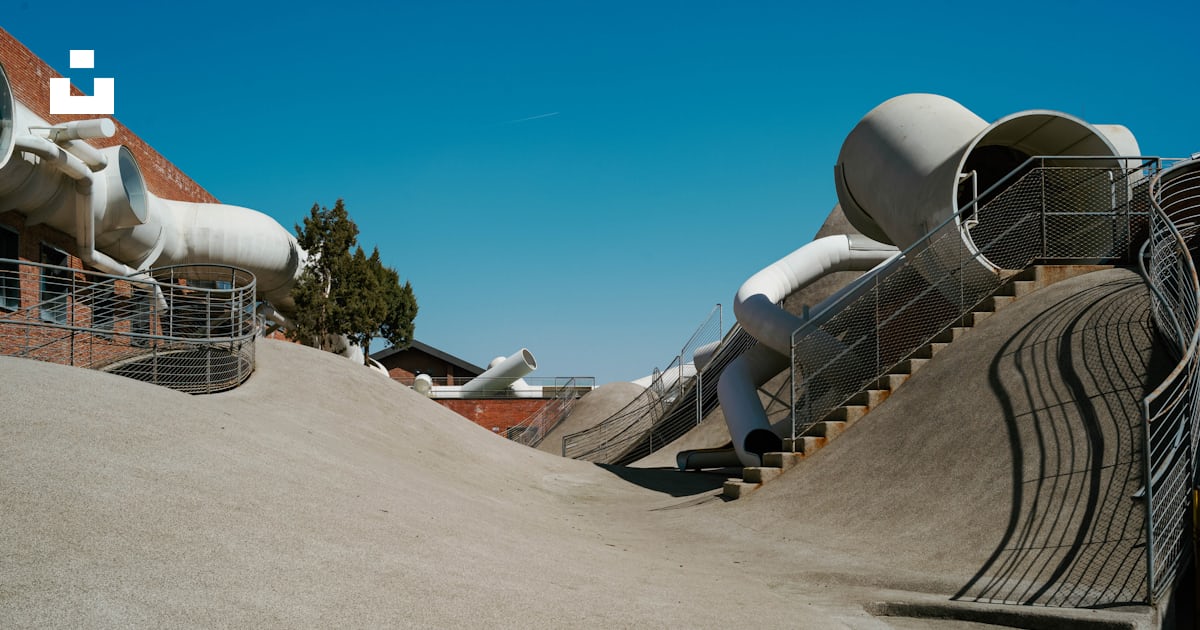 A skateboard park with ramps and slides photo – Free Play area Image on ...