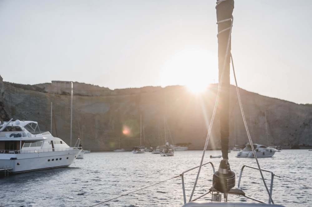 the sun is shining on a boat in the water