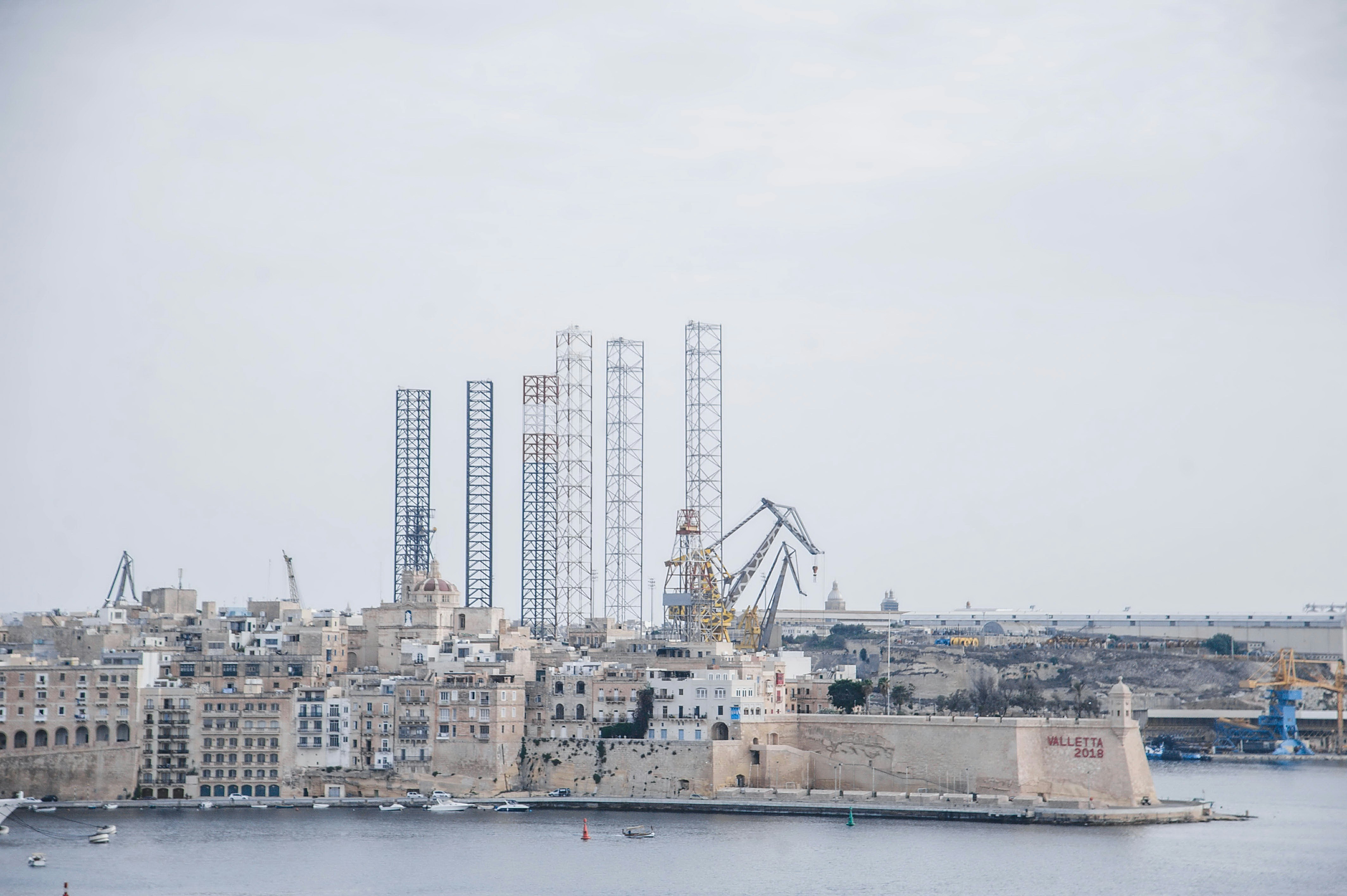 a large body of water with a city in the background