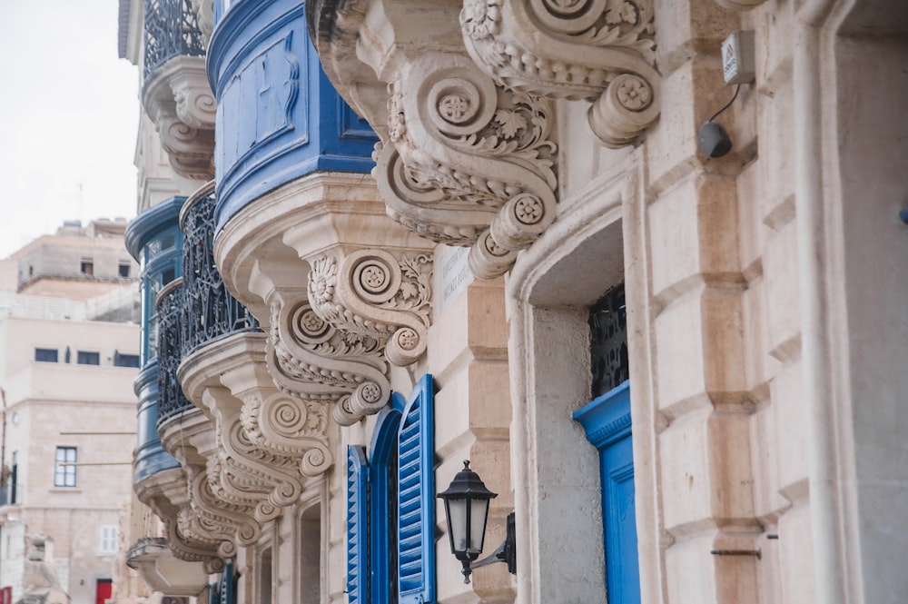 a row of blue and white balconies on a building