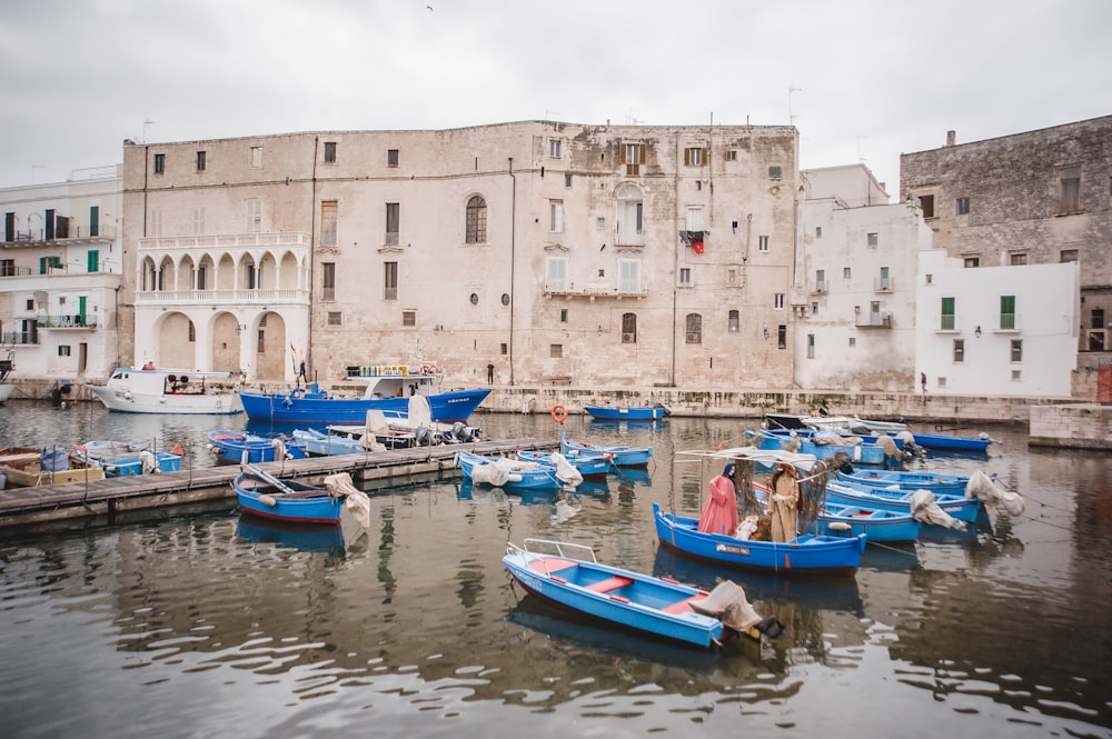 a group of small boats in a harbor