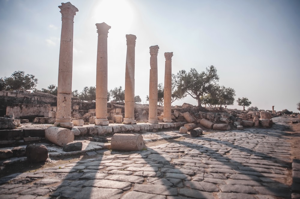 the sun is shining on the ruins of the ancient city