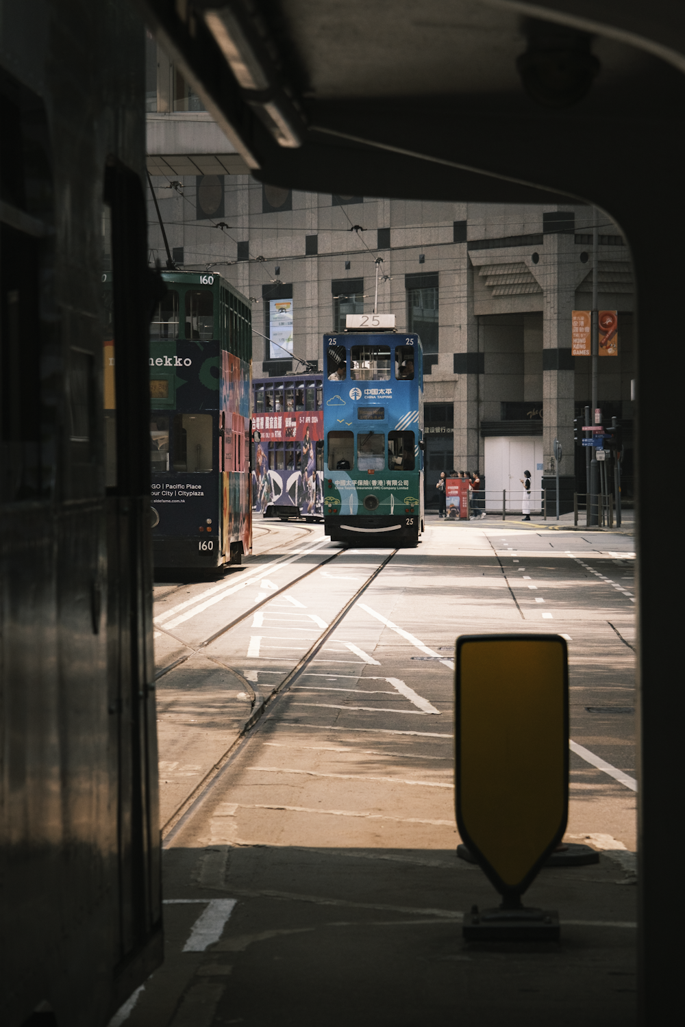 a double decker bus driving down a street