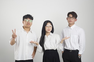 a group of three people standing next to each other