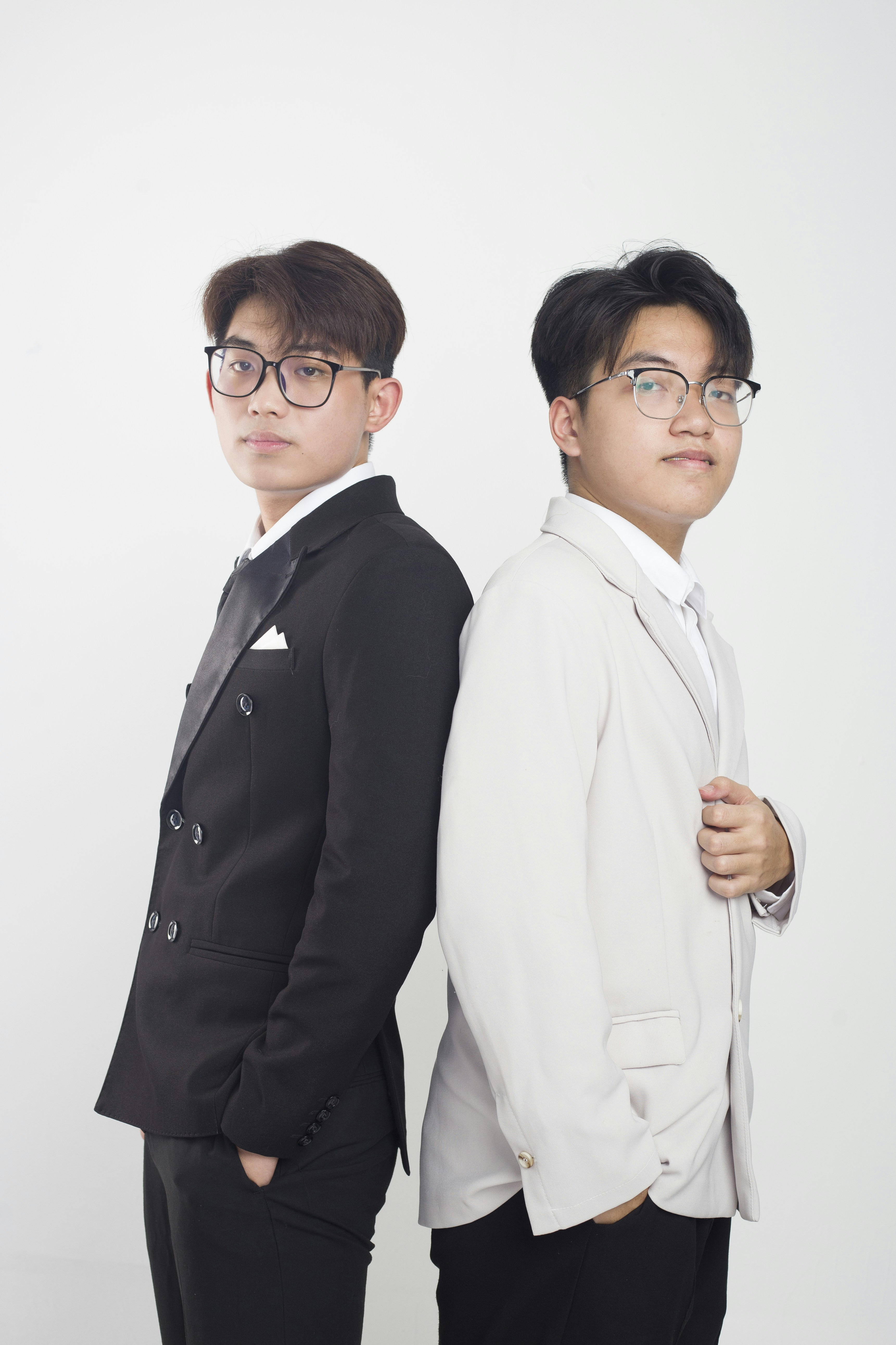 two young men standing next to each other