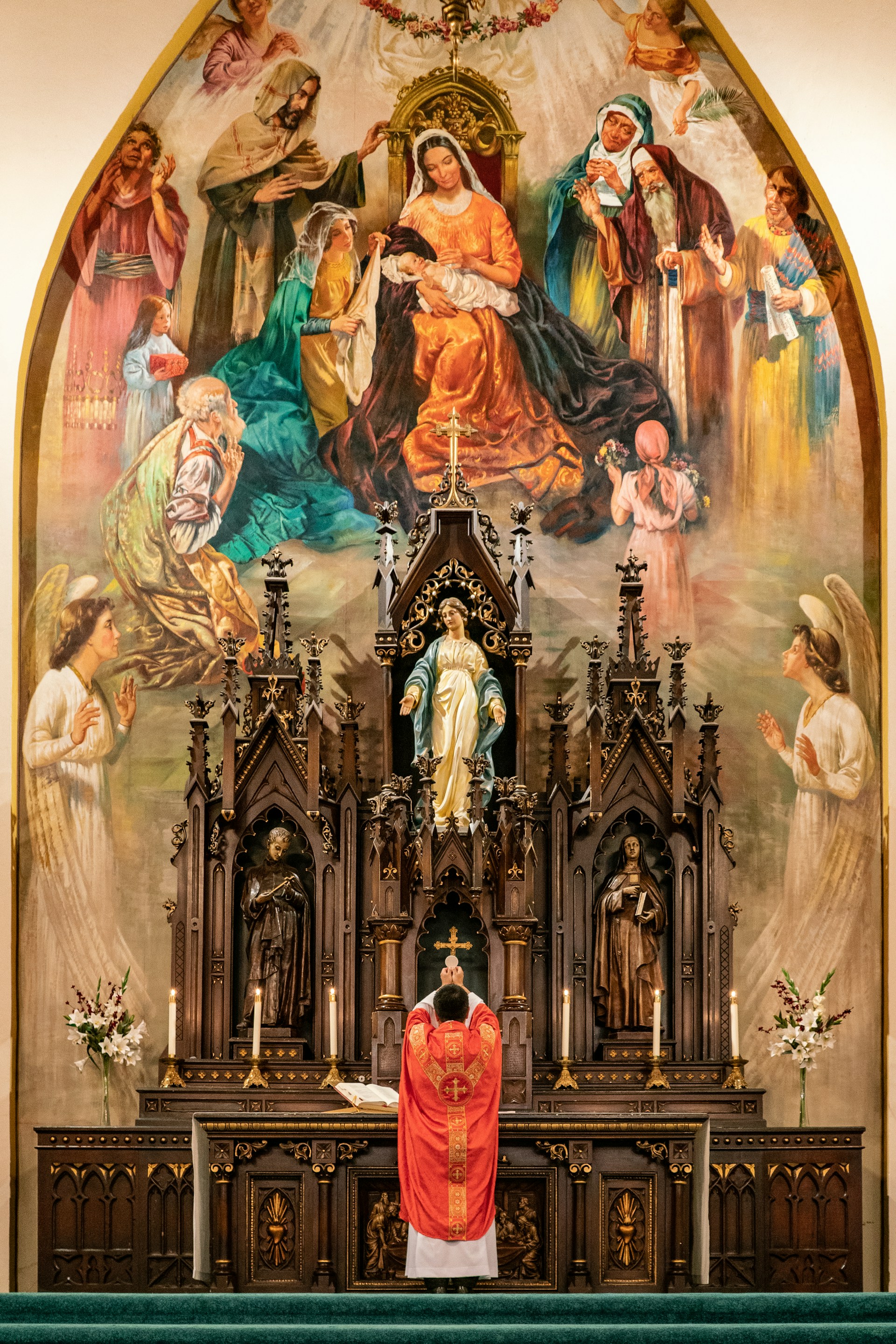 a priest standing at the alter of a church