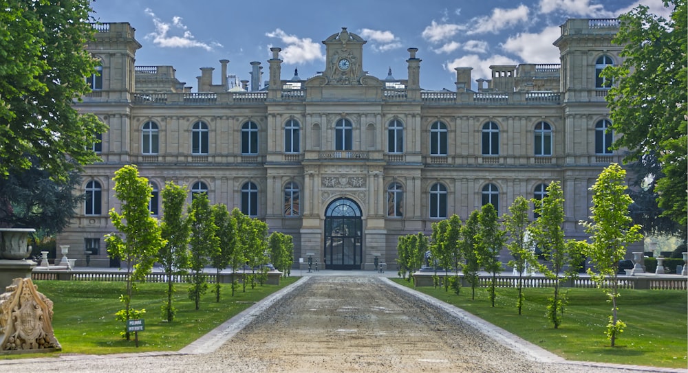 a large building with a long driveway in front of it