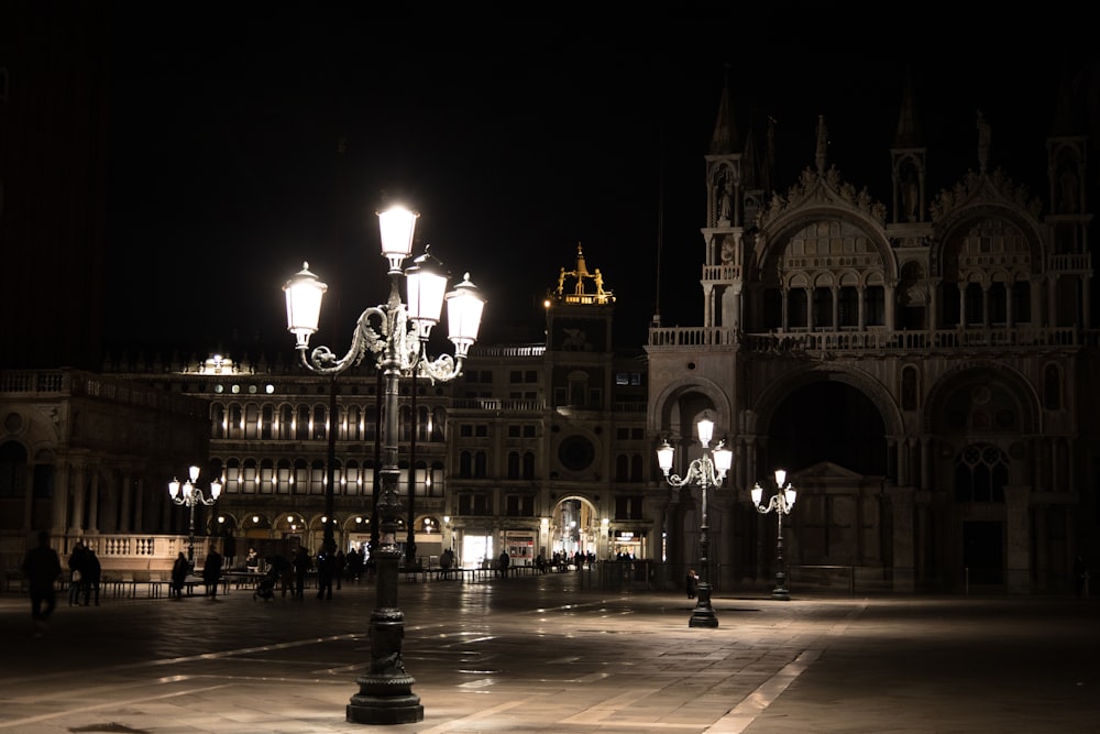 a street light in front of a building at night