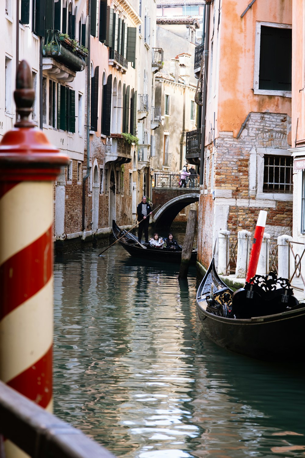 a couple of gondolas that are in the water