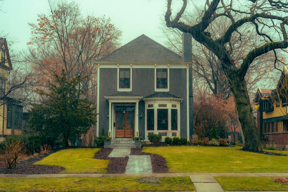 a house with a tree in front of it