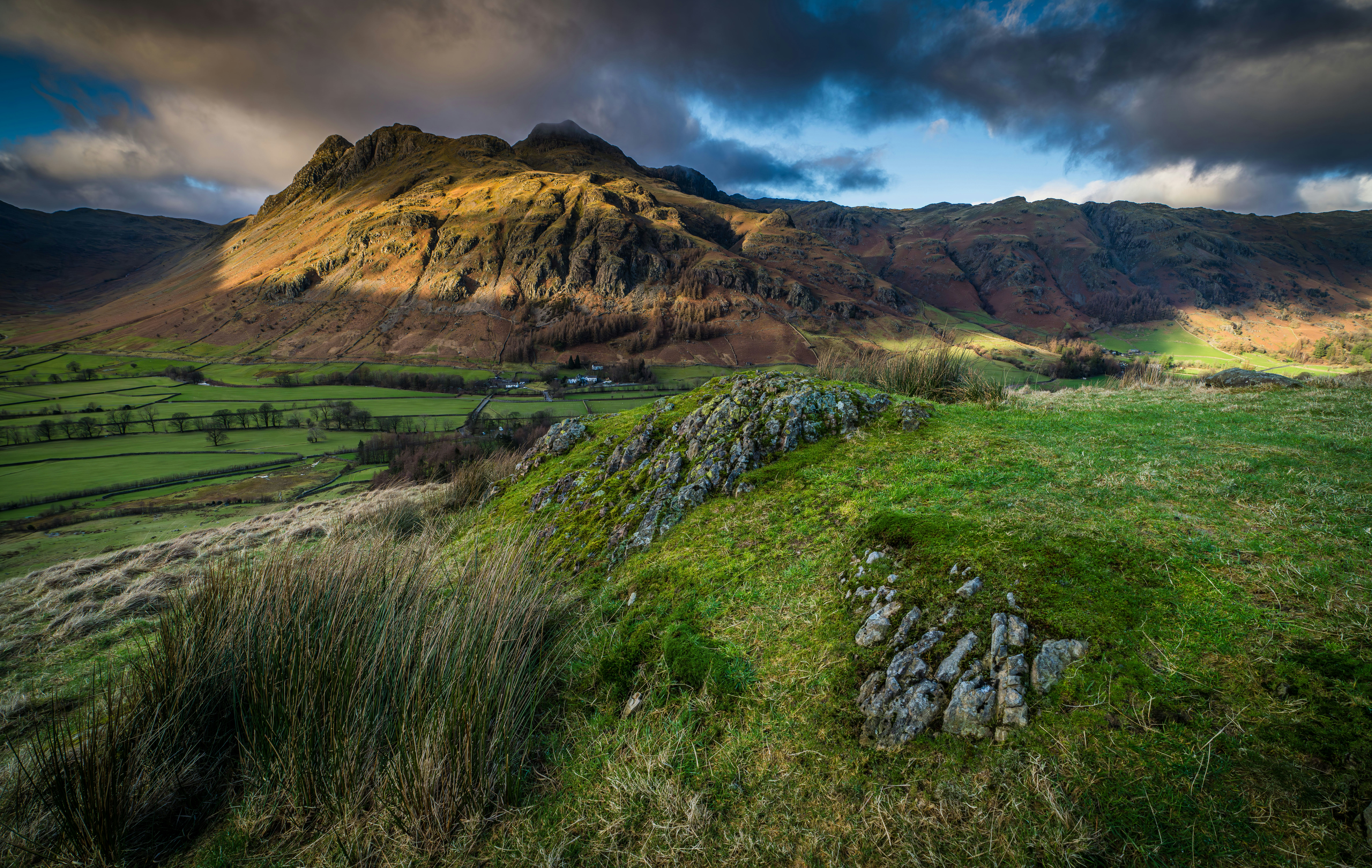 A grassy field with a mountain in the background photo Free Ambleside