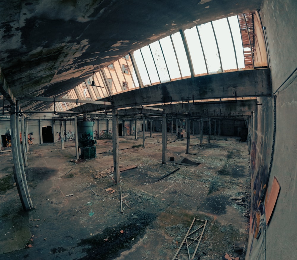 an abandoned building with lots of windows and graffiti on the walls