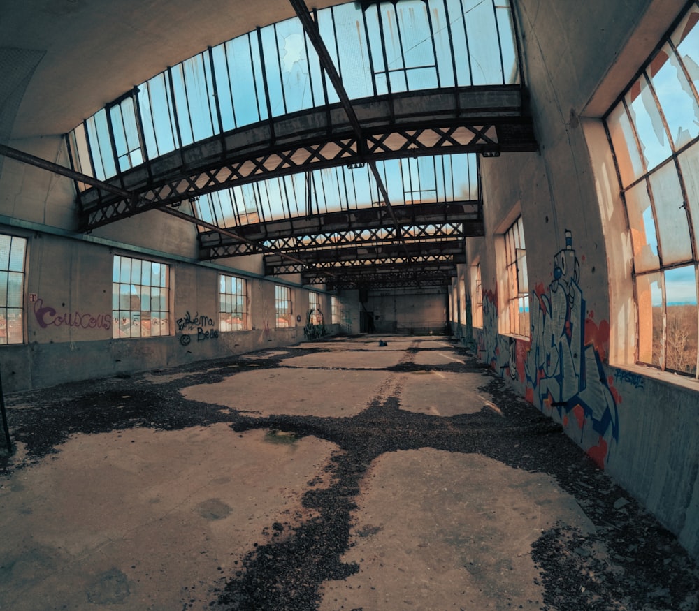 an abandoned building with graffiti on the walls