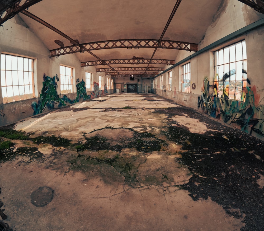 an abandoned building with graffiti on the walls