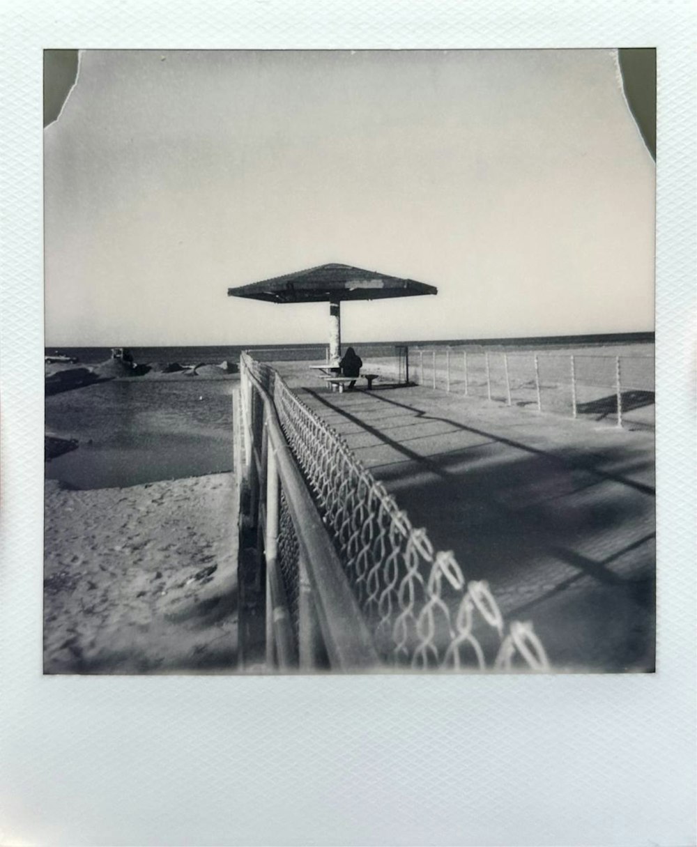 a black and white photo of a beach