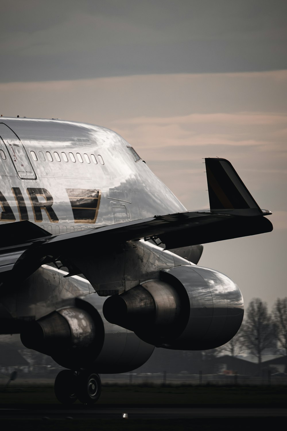 a large jetliner sitting on top of an airport runway