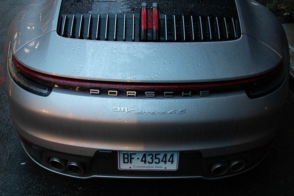 a porsche parked on the side of the road