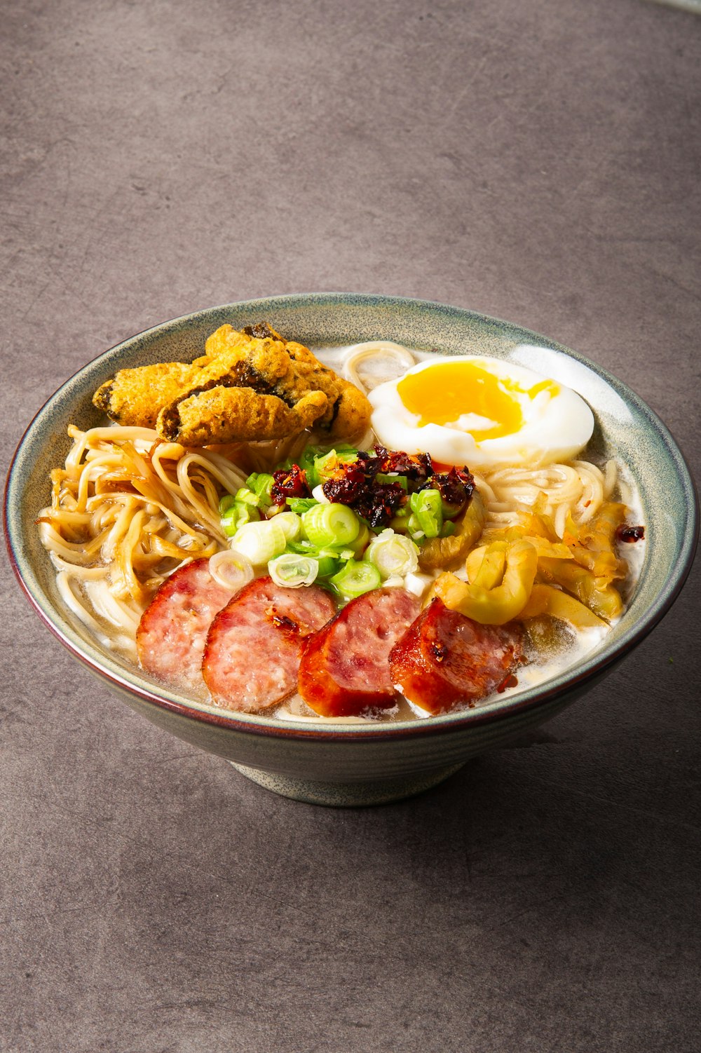 a bowl of ramen with a fried egg on top