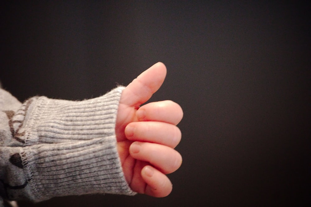 a close up of a person holding a cell phone