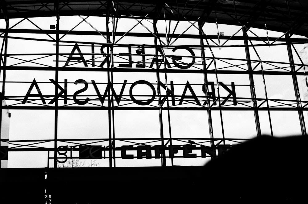 a black and white photo of a large sign