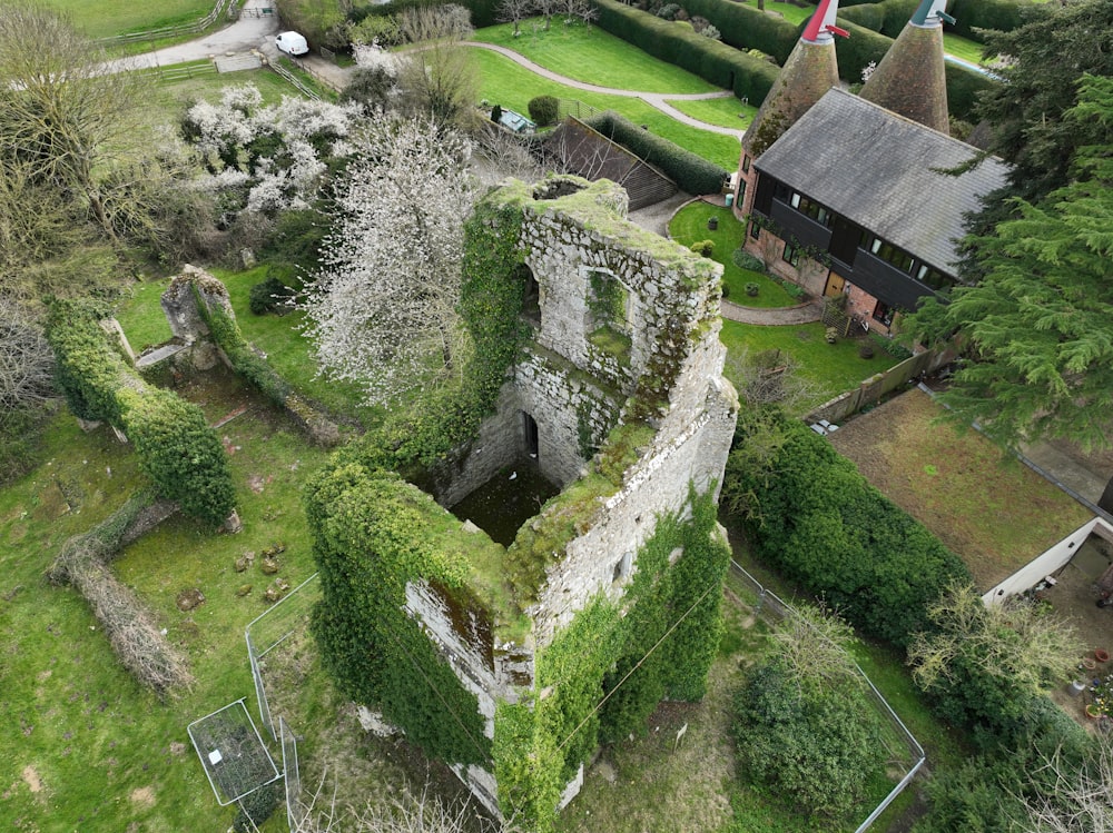 an aerial view of an old castle with a garden