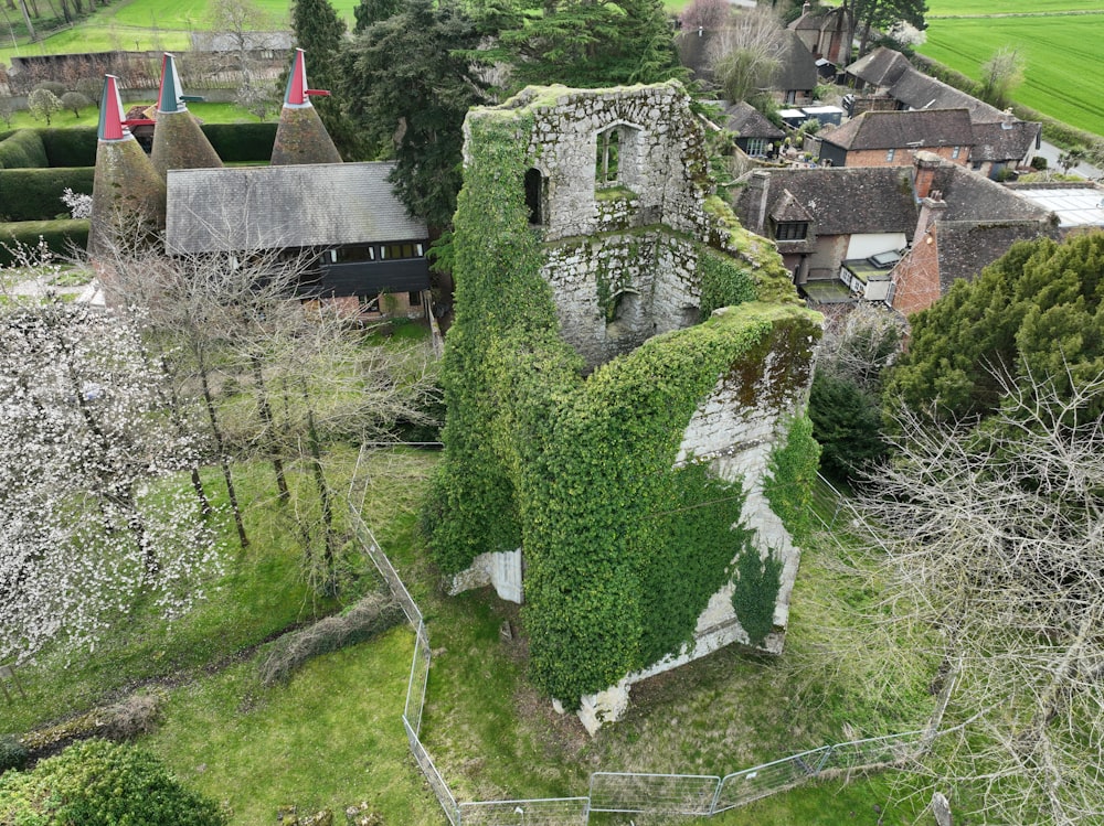 an aerial view of a building covered in vines