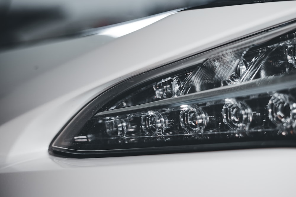 a close up of a headlight on a car