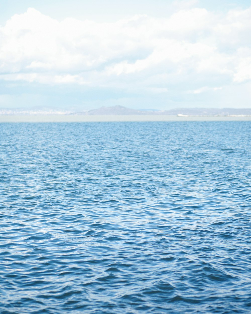 a boat floating on top of a large body of water