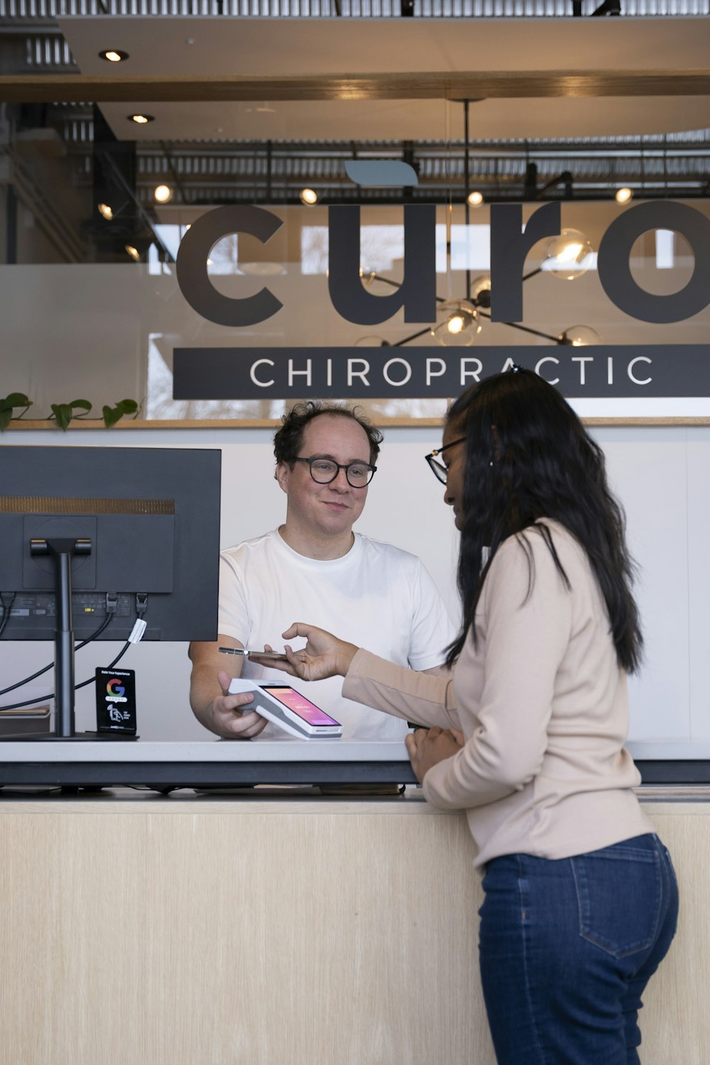 a man and a woman standing at a counter