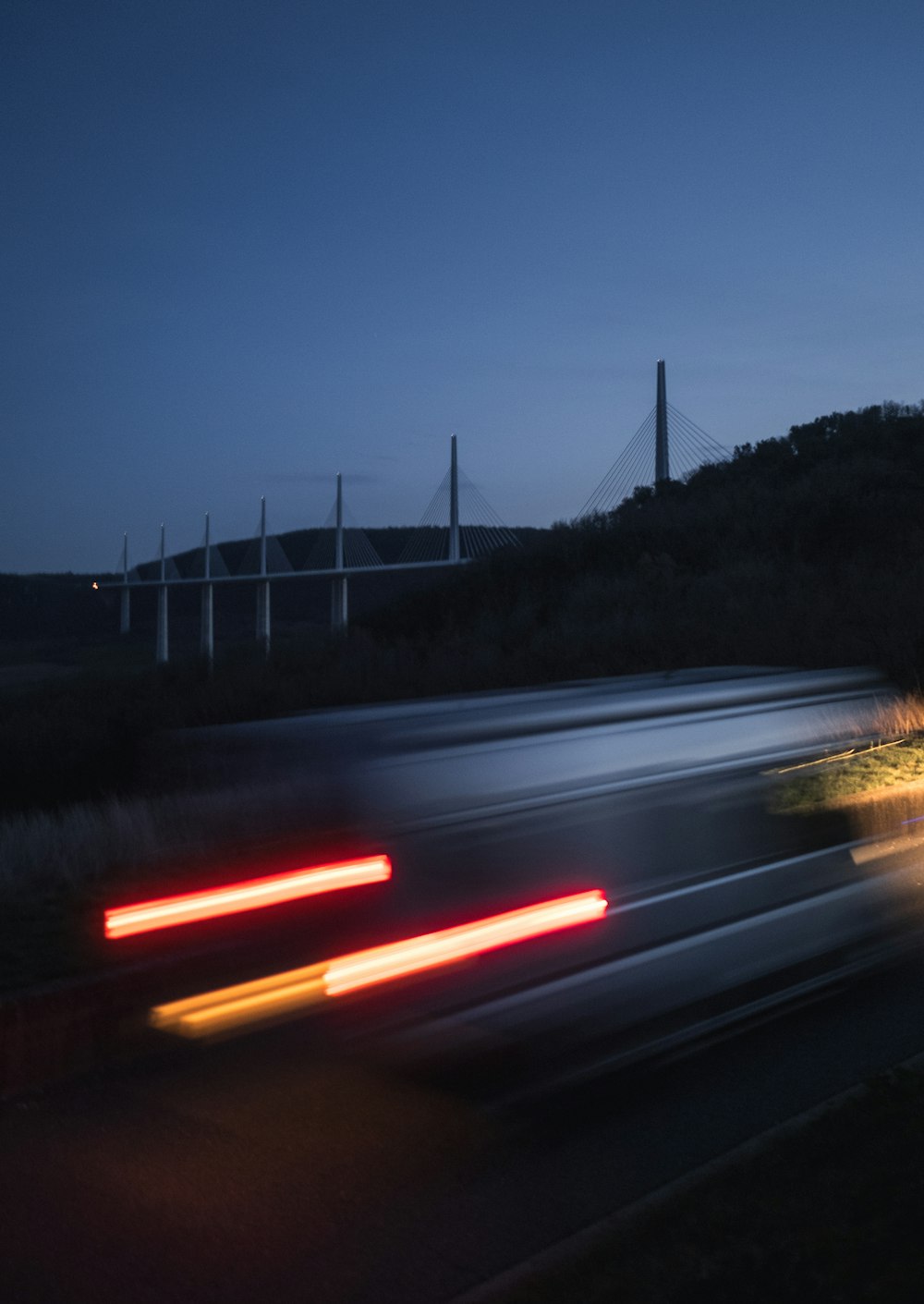 a blurry photo of a truck driving down the road