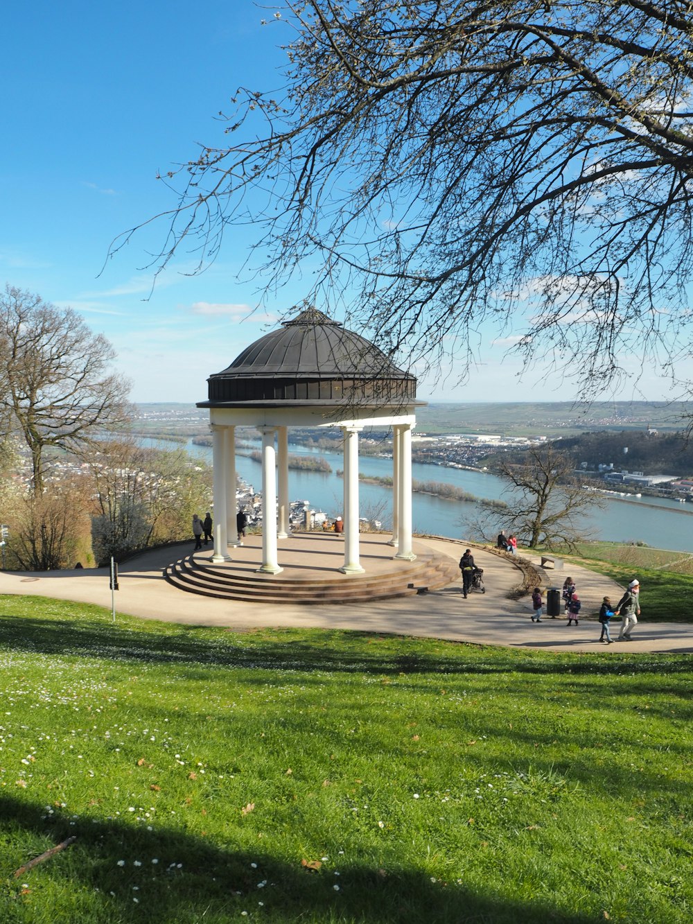 a gazebo in the middle of a grassy field