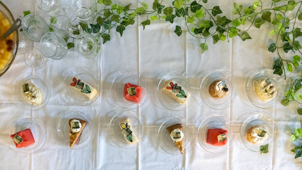 a table topped with glasses filled with desserts