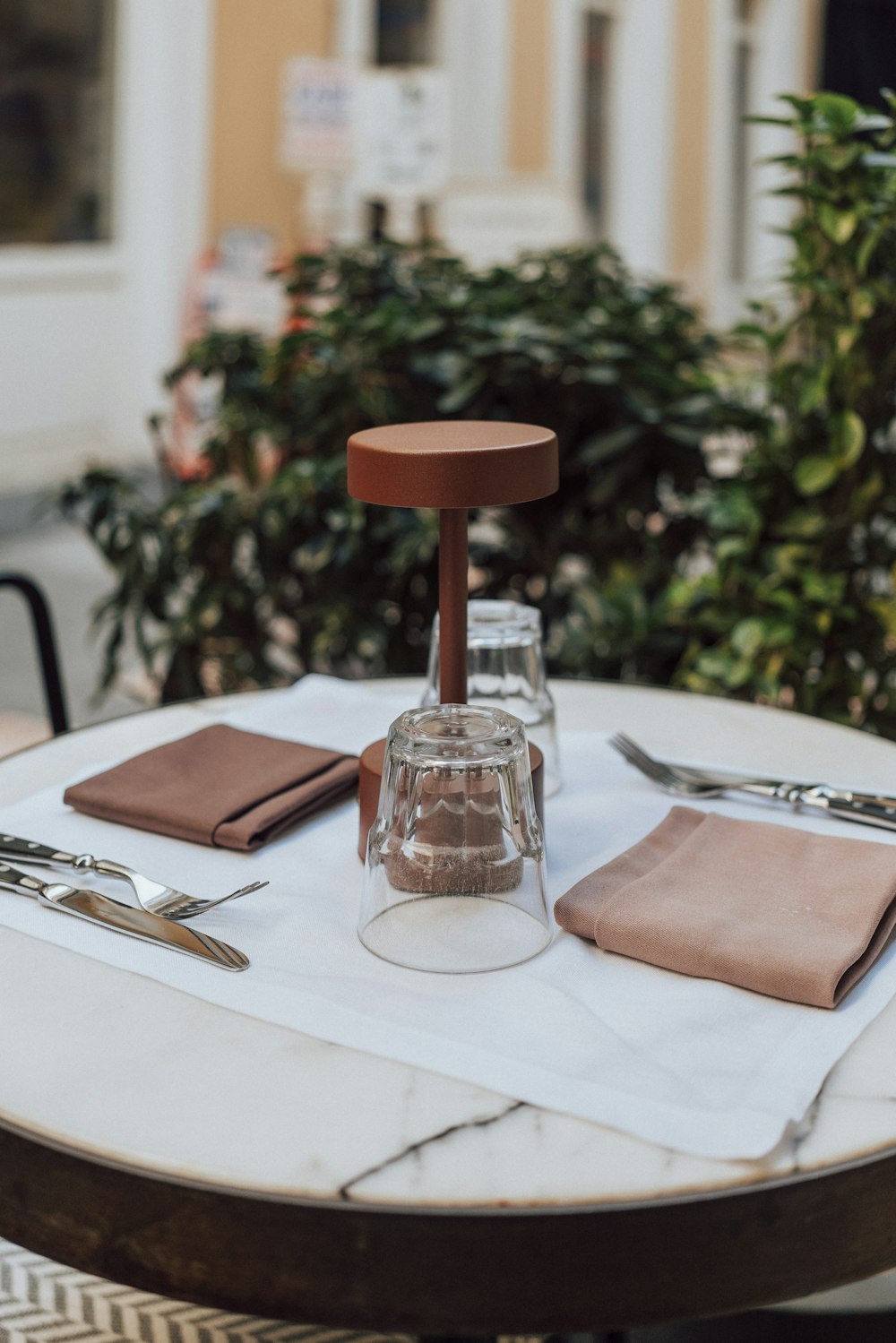 a table with a knife, fork and napkin on it