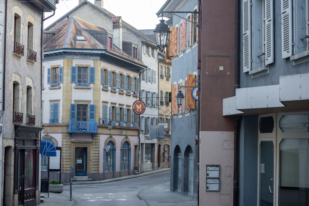 a city street with buildings and a street sign