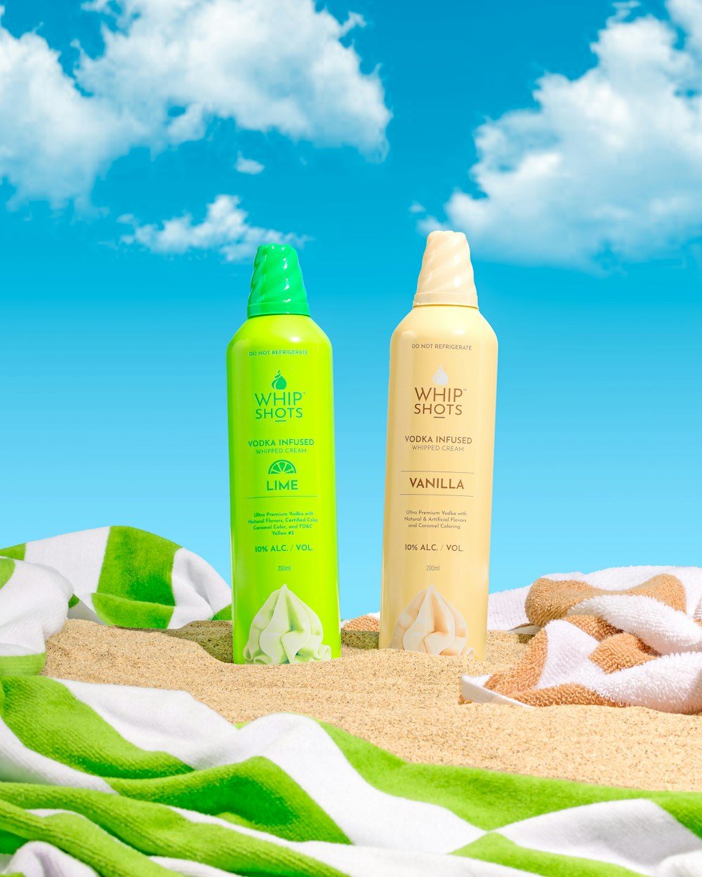 a couple of bottles of hair products sitting on top of a beach