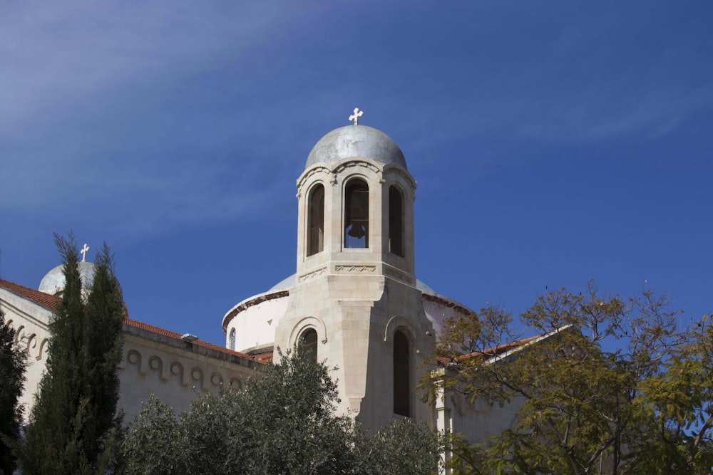 a church with a steeple and a cross on top