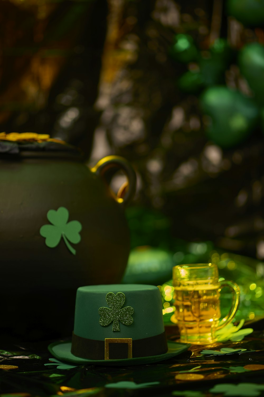 a pot of beer and a green hat on a table