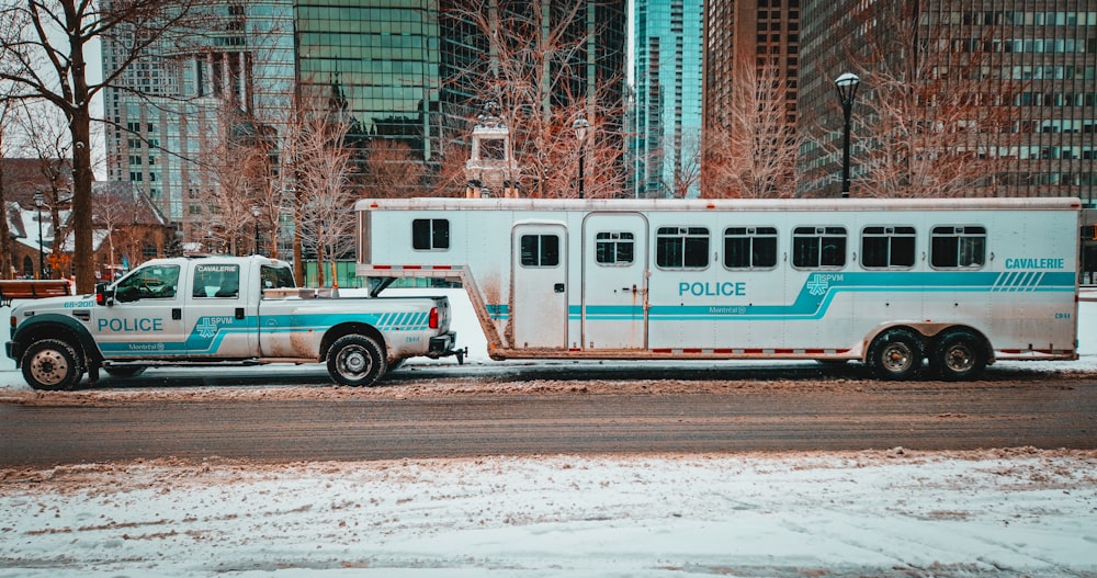 a police truck parked next to a police bus