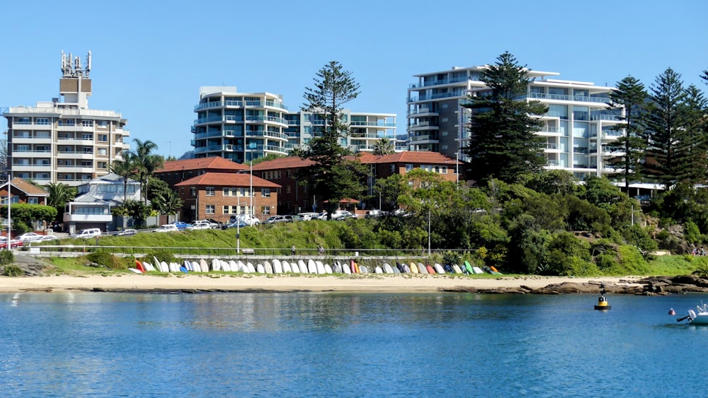 a body of water with buildings in the background