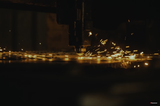 a close up of a machine cutting a piece of metal