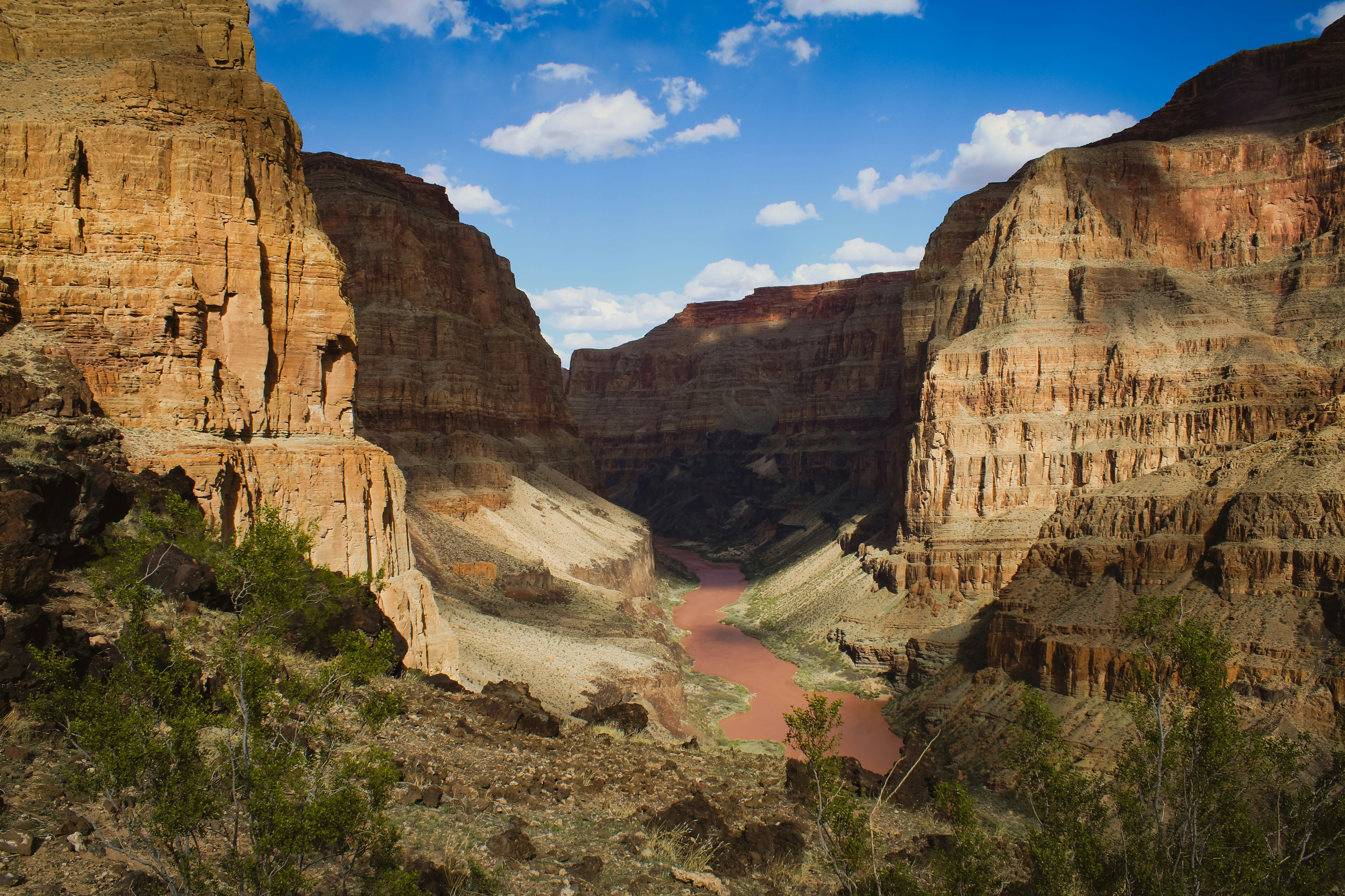 a river in a canyon surrounded by mountains