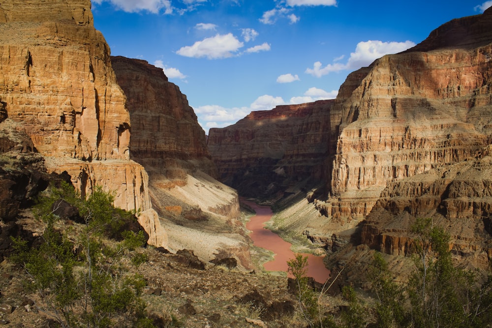 a river in a canyon surrounded by mountains